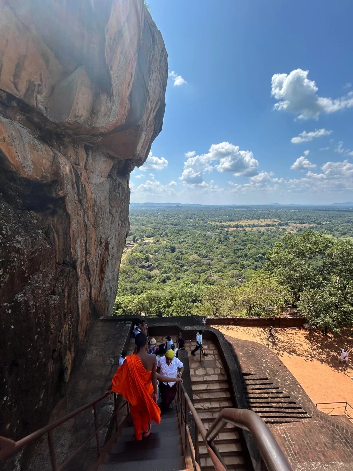 Heading down the stairs near the historic Mirror Wall at Sigiriya