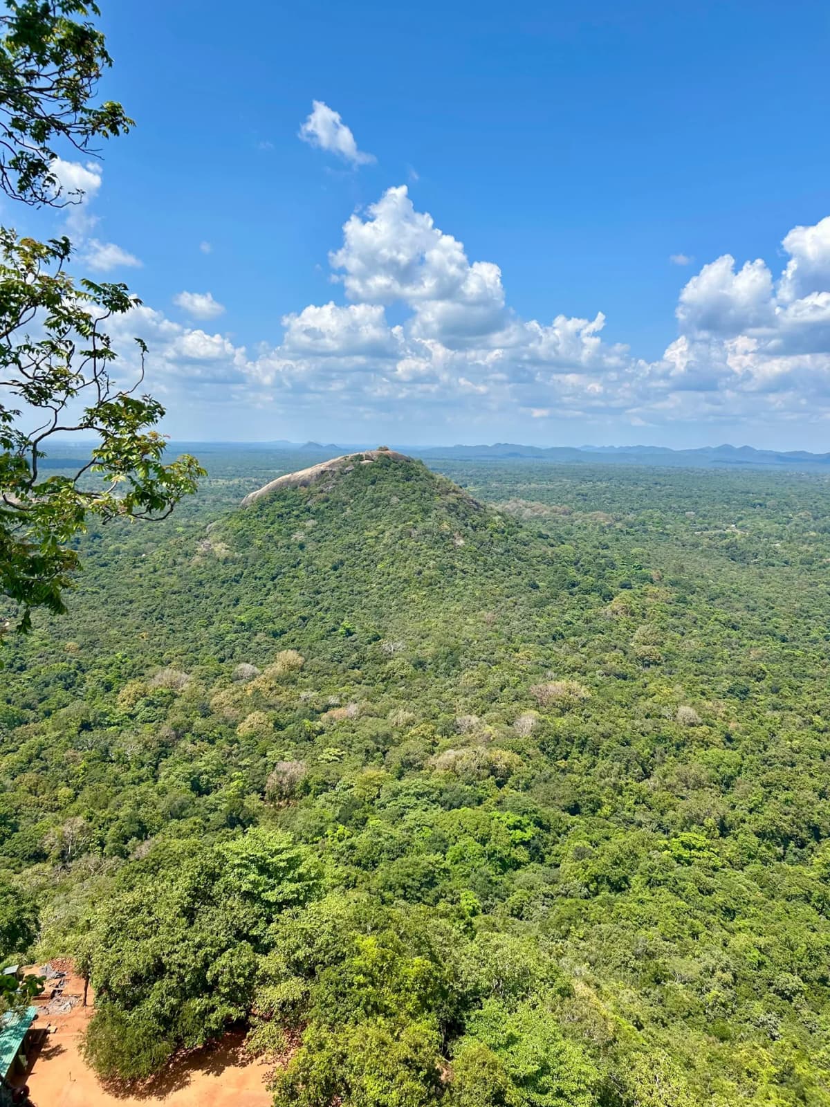 A scenic view looking out towards Pidurangala Rock in the distance from Sigiriya